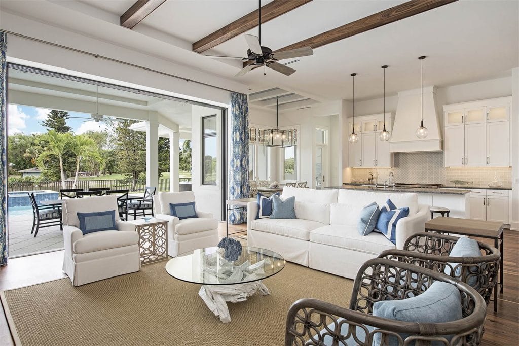 Coastal transitional living room with light colors and natural elements, by Decorilla designer, Wanda P.