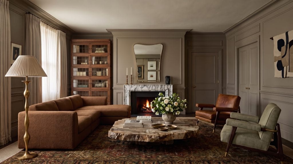 Comfortable seating in an earthy, trendy living room by Decorilla