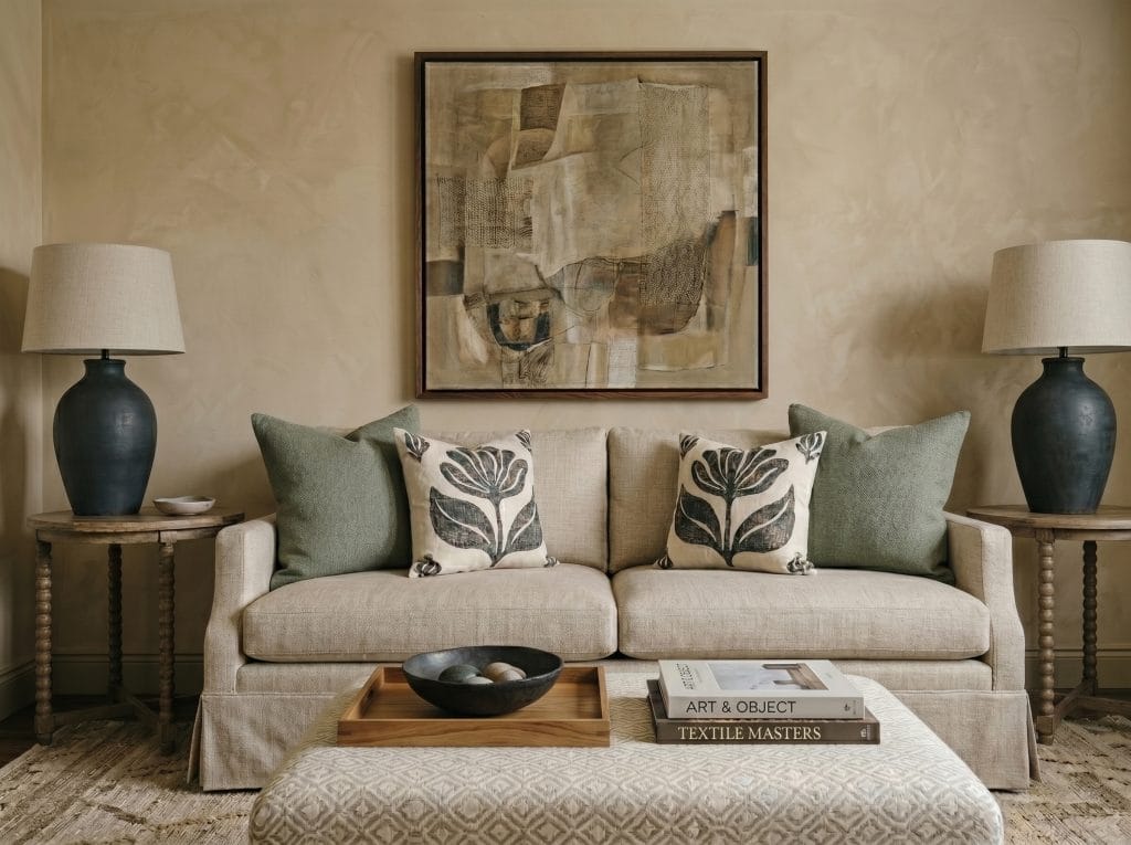 Pale sage green limewash walls in a living room interior by Decorilla