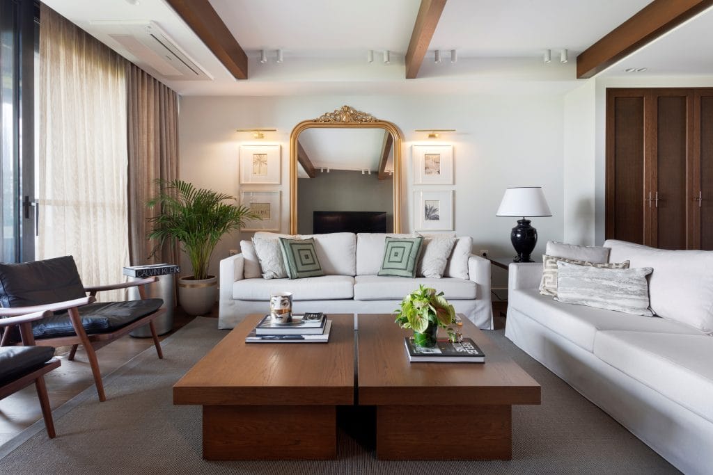 Trendy yet timeless living room by Decorilla designer, Meric S., with no technology in sight