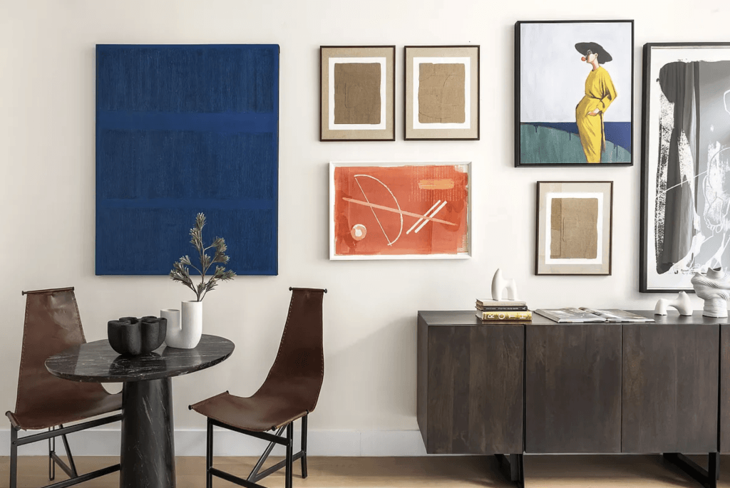 Weathered leather against polished marble in a living room by Decorilla designer, Leanna S.