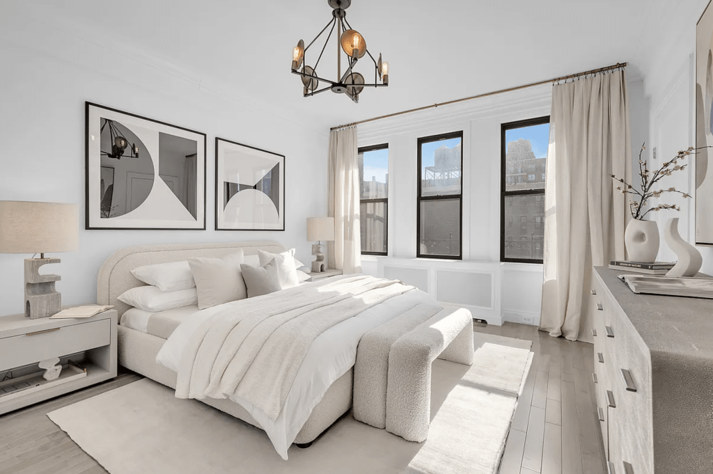 Greige furniture and decor layered with cream and beige in a bedroom by Decorilla designer, Leanna S.