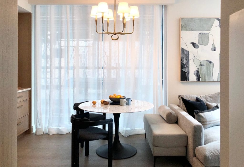 Greige furniture in a small open plan living area by Decorilla designer, Chanelle M.
